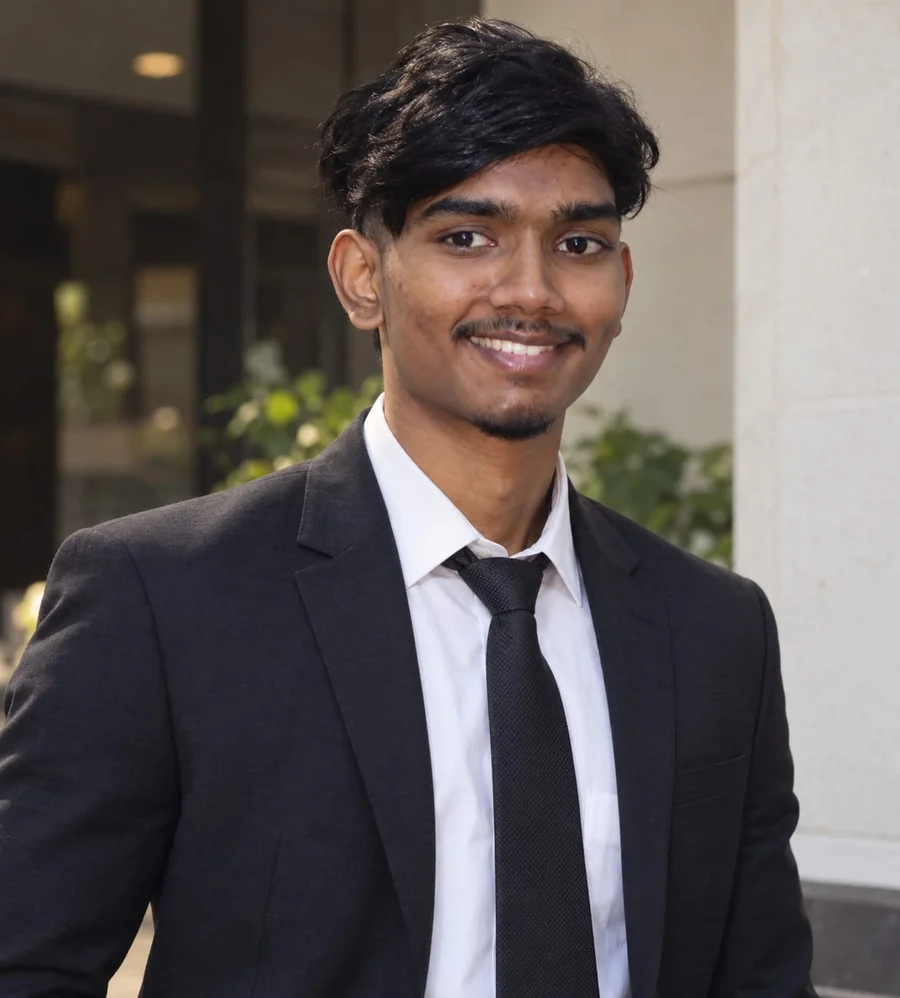 Jasvin Raj wearing a suit, founder and developer of MIRROR